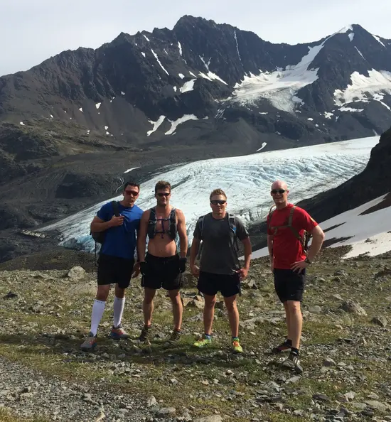 Dr. Matt hiking with friends in front of a glacier